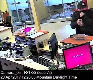Surveillance video showing a man police are looking to identify in relation to an armed robbery at a CIBC in Airdrie on April 29. 