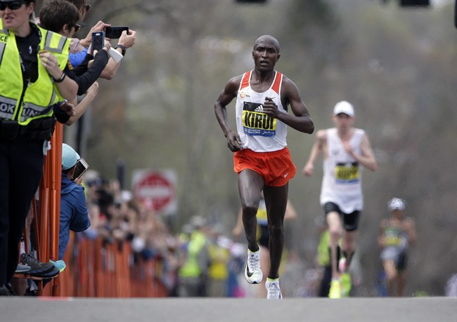 Geoffrey Kirui, of Kenya, leads Galen Rupp, of the United States, and the rest of the field along the course of the 121st Boston Marathon on Monday, April 17, 2017, in Brookline, Mass.
