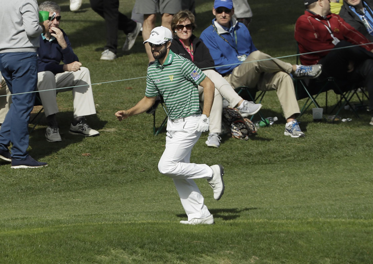 Adam Hadwin runs to the green n the 13th hole during the second round of the Masters golf tournament Friday, April 7, 2017, in Augusta, Ga.