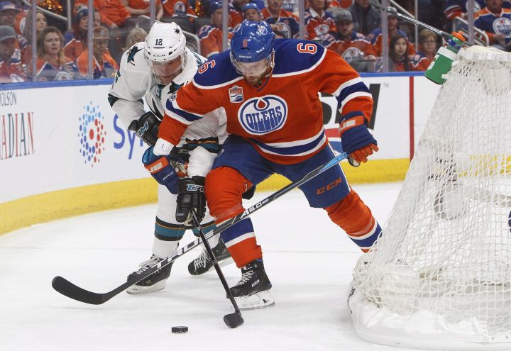 San Jose Sharks' Patrick Marleau (12) and Edmonton Oilers' Adam Larsson (6) battle for the puck during first period NHL playoff action in Edmonton, Alta., on Friday April 14, 2017. 