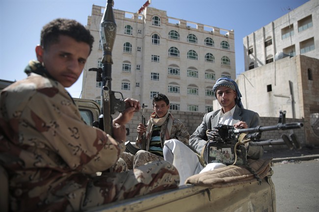 Shiite fighters, known as Houthis, pose for a photo. 
