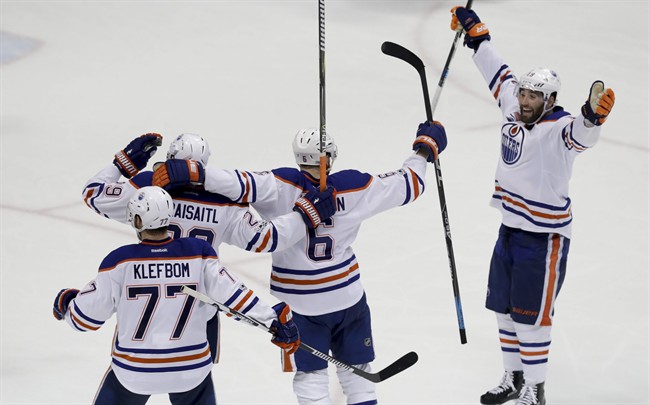 Edmonton Oilers celebrate after a goal by defenseman Adam Larsson (6) against the Anaheim Ducks during the third period in Game 1 of a second-round NHL hockey Stanley Cup playoff series in Anaheim, Calif., Wednesday, April 26, 2017. The Oilers won 5-3.