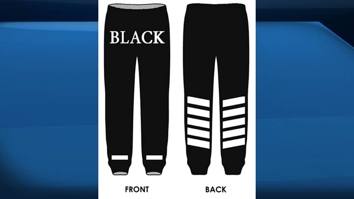 The second suspect was wearing a black cap, black scarf, black-hooded jacket and black pants with the word “BLACK” written in white letters and white striping on the back lower legs.