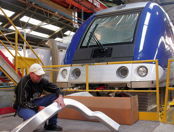 An employee works on a train inside the Bombardier Inc. factory in Crespin, northern France, Wednesday Oct. 25, 2006. 