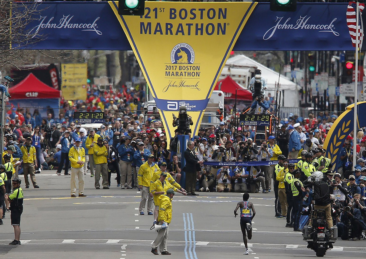 Edna Kiplagat of Kenya runs to the finish line to win the Women’s Division of the 121st Boston Marathon.
