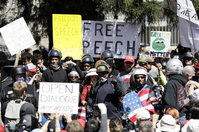 A crowd gathers around speakers during a rally for free speech on Thursday, April 27, 2017, in Berkeley, Calif.