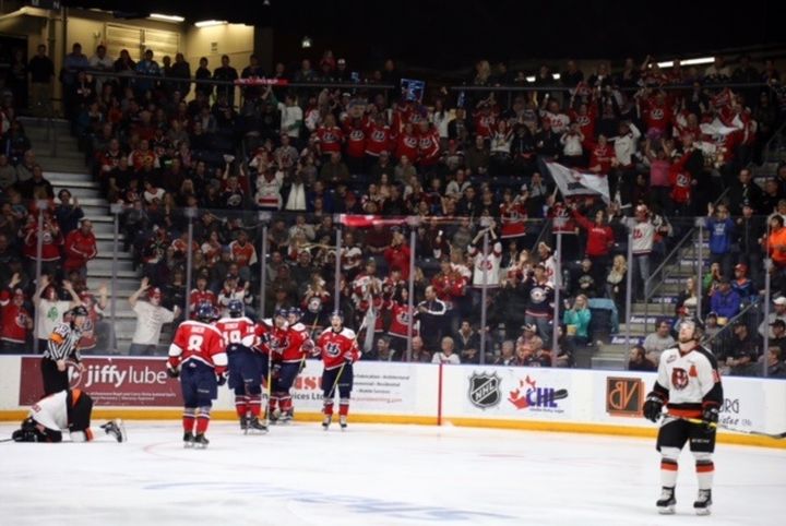 A strong contingent of Lethbridge Hurricanes fans celebrate a third period Ryan Vandervlis goal in game five. 
