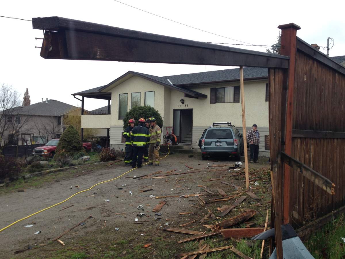 Driver sent to hospital after car hits Kelowna home - image