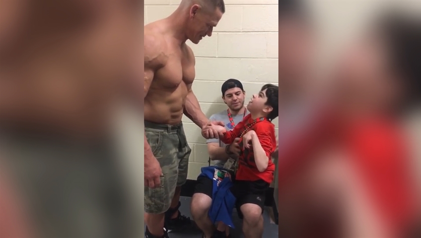 WWE star John Cena surprises young fan with cerebral palsy in