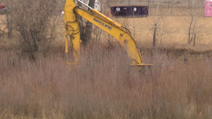 Construction to improve fish habitat in a Bow River channel near Quarry Park