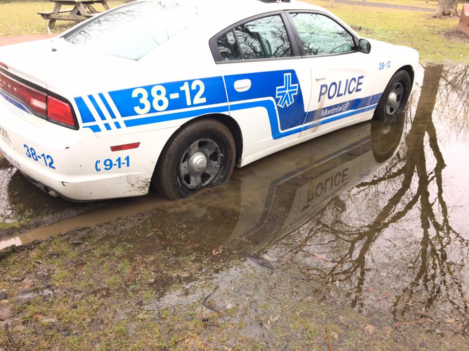 A Montreal police cop car was found stuck in the mud at Baldwin Park in the Plateau, Tuesday, April 12, 2017.