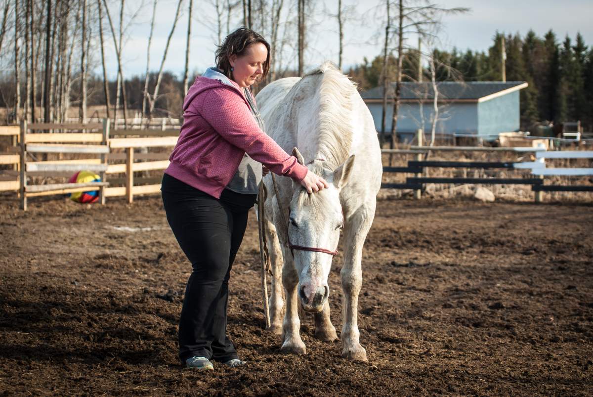 Cora Dion and her family escaped the fire on horseback last May. 