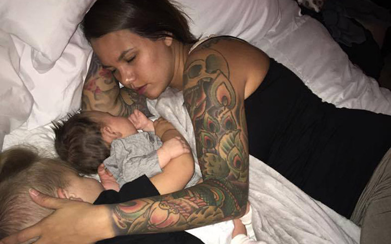 A photo of Alora Brinkley of Oklahoma City, Okla., napping with her two-year-old son and her baby daughter has sparked a debate on social media about "co-sleeping.".