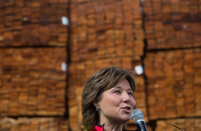 Liberal Leader Christy Clark addresses workers and local candidates while standing in front of stacks of western red cedar wood during a campaign stop at CedarLine Industries, a manufacturer of western red cedar products, in Surrey, B.C., on Monday April 24, 2017. A provincial election will be held on May 9. 