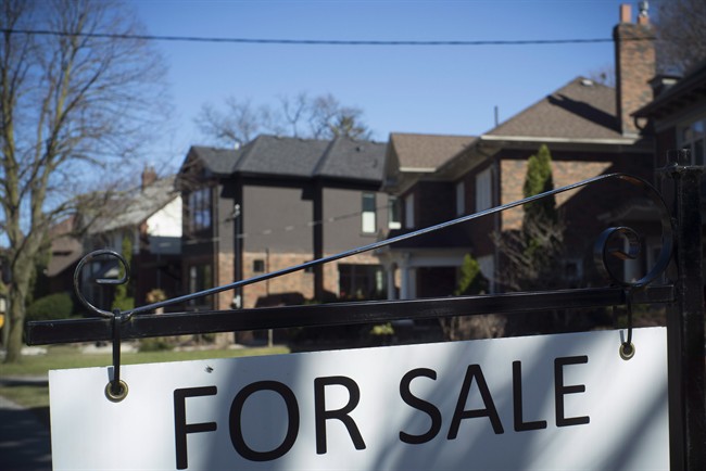 A sold sign is shown in front of west-end Toronto homes on April 9, 2017. 