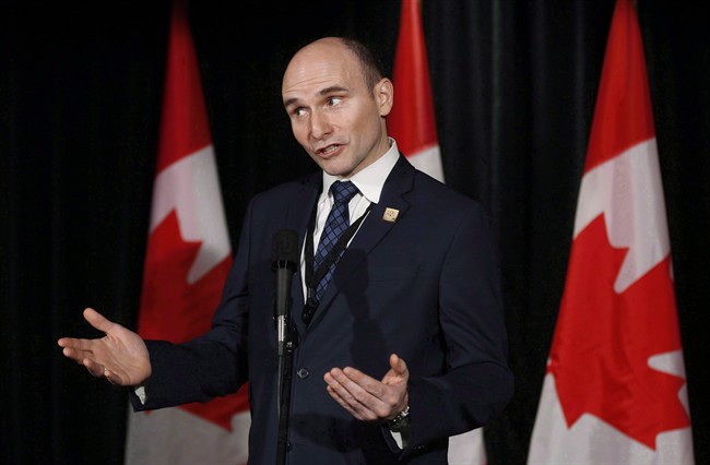 Social Development Minister Jean-Yves Duclos speaks to reporters at a Liberal cabinet retreat in Calgary, Alta., Tuesday, Jan. 24, 2017. 