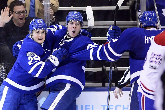 Toronto Maple Leafs' Auston Matthews (34) and teammate William Nylander (29) celebrate after Matthews' second goal during third period NHL action against the Montreal Canadiens, in Toronto on Saturday, Feb. 25, 2017.