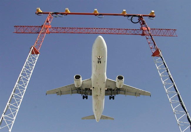 An Air Canada flight makes its final approach as it lands at Pearson International Airport in Toronto. 
