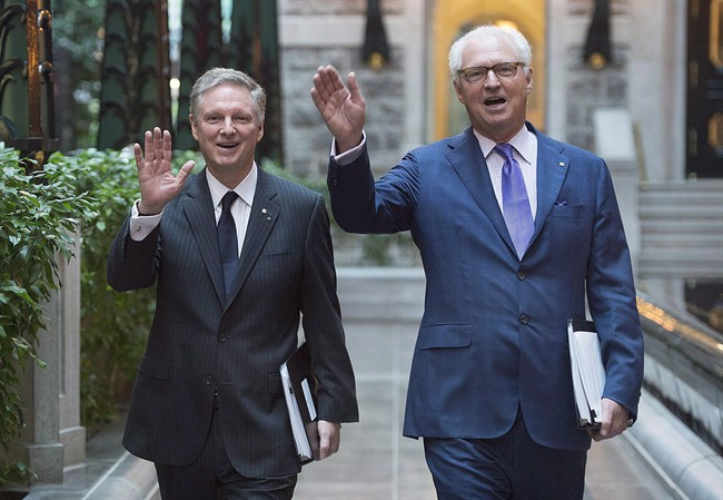 Power Corporation Chairman and Co-Chief Executive Officer Paul Desmarais, left, and Deputy Chairman, President and Co-CEO André Desmarais arrive for the company's annual general meeting in Montreal on May 13, 2016. 