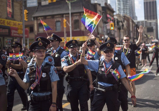 FILE: Hamilton, Ont. police officers march along the parade route during the annual Pride Parade in Toronto, Sunday, July 3, 2016.