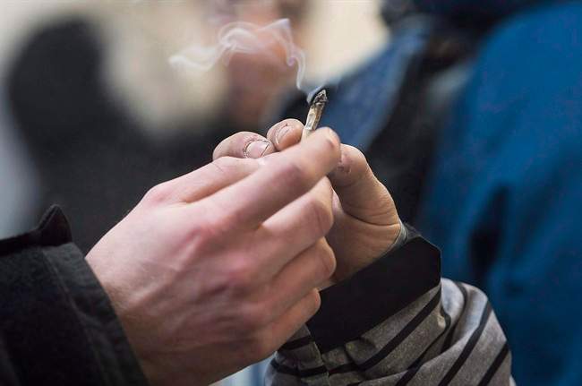 A marijuana joint is shared at Cannabis Culture in Montreal, Friday, December 16, 2016.