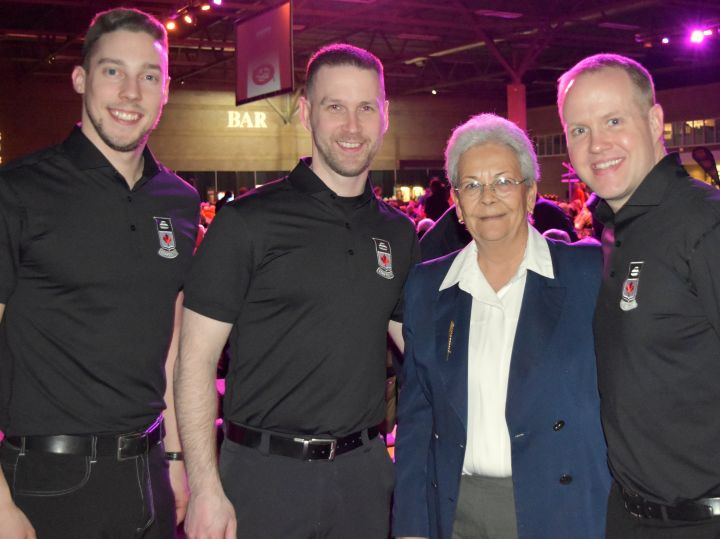 Gabriela Fernandez with Team Canada's Brett Gallant, Brad Gushue and Mark Nichols. 