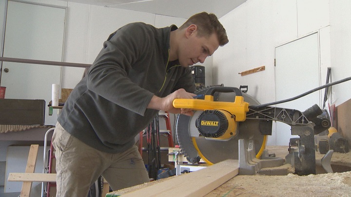 Manitoba Moose forward Darren Kramer doing some carpentry work in his spare time.