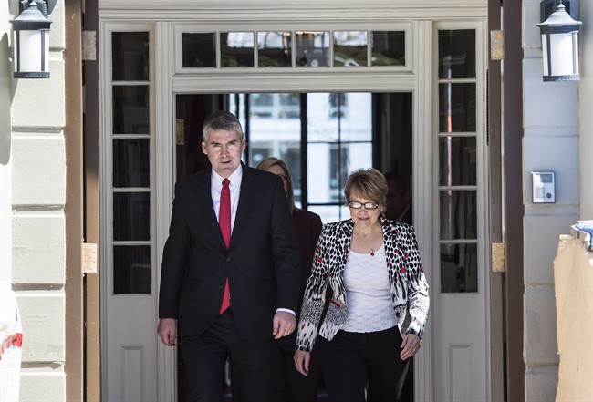 Nova Scotia Premier Stephen McNeil, left, and his wife Andrea leave Government House after asking the Lieutenant Governor to dissolve the House in order to call a provincial election in Halifax on Sunday, April 30, 2017.