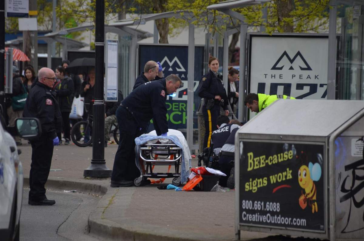 Police and ambulance respond to a hostage taking at a Langley bus loop Saturday.