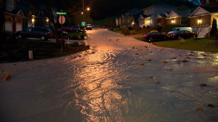 Watsons Lane in Dundas was one of several streets flooded after heavy rains Thursday.