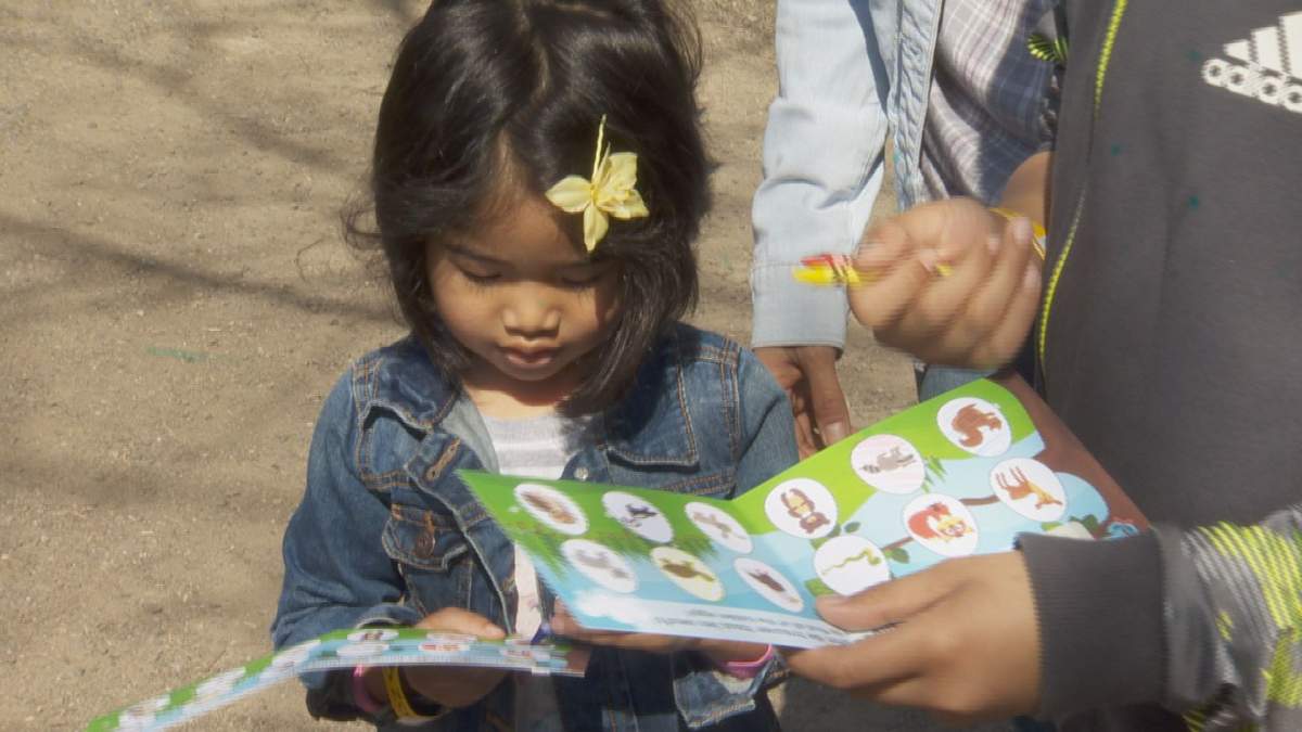 A child takes part in a fact-finding mission at the Ecomuseum’s annual Easter Egg Hunt. Saturday, April 15, 2017.
