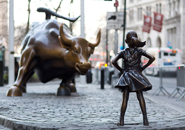 “Charging Bull” and “Fearless Girl” statues are sit on Lower Broadway in New York.