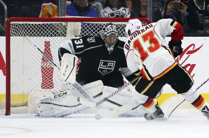 Calgary Flames left winger Johnny Gaudreau (13) looks for a shot against Los Angeles Kings goalie Ben Bishop (31) during the second period of an NHL hockey game in Los Angeles on Thursday, April 6, 2017. 