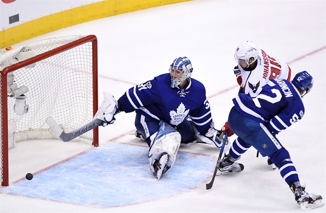 Washington Capitals centre Marcus Johansson (90) scores against Toronto Maple Leafs goalie Frederik Andersen (31) as defenceman Martin Marincin (52) defends during the first overtime period of game six in an NHL Stanley Cup hockey first-round playoff series in Toronto on Sunday, April 23, 2017. 