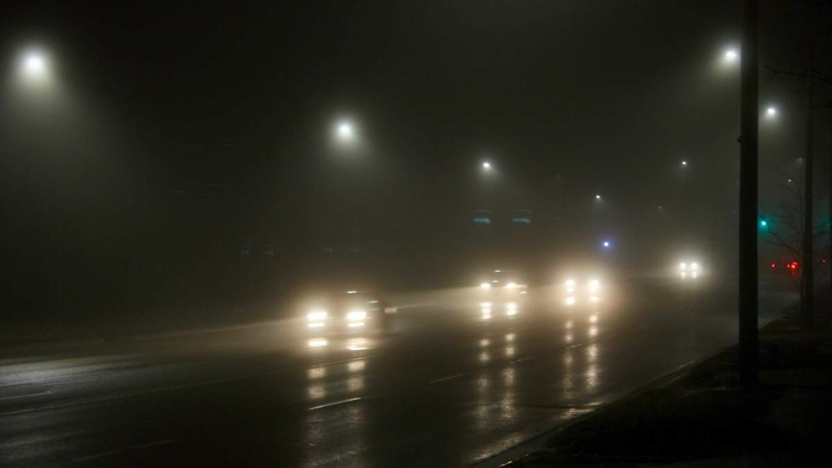 An early foggy morning drive on Oxford Street in London, Ont.