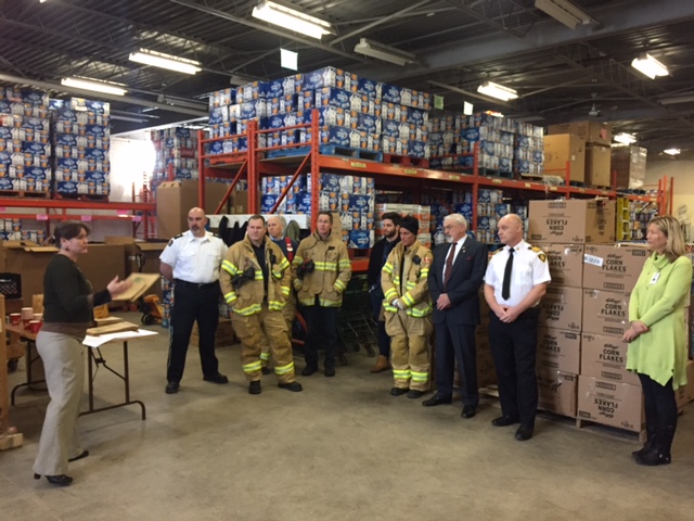 Staff from the London Food Bank, St. John's Ambulance and the London Fire Department gather to mark the 30th annual Spring Food Drive.