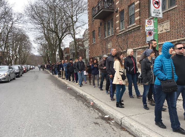 French voters in Montreal, stand in a line spanning several city blocks waiting to cast a vote in their country's presidential election. Saturday, April 22, 2017.