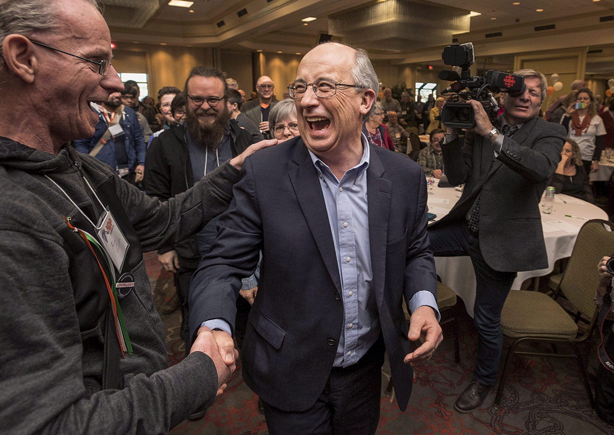 Gary Burrill, centre, celebrates with supporters following his election as leader of the Nova Scotia New Democratic Party during the party convention, in Dartmouth, N.S., on Saturday, Feb. 27, 2016. 
