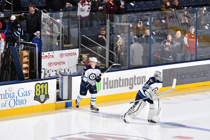 Jack Roslovic and Eric Comrie take the ice for pregame warmups prior to the Winnipeg Jets game against the Columbus Blue Jackets on April 6, 2017 at Nationwide Arena in Columbus, Ohio.  