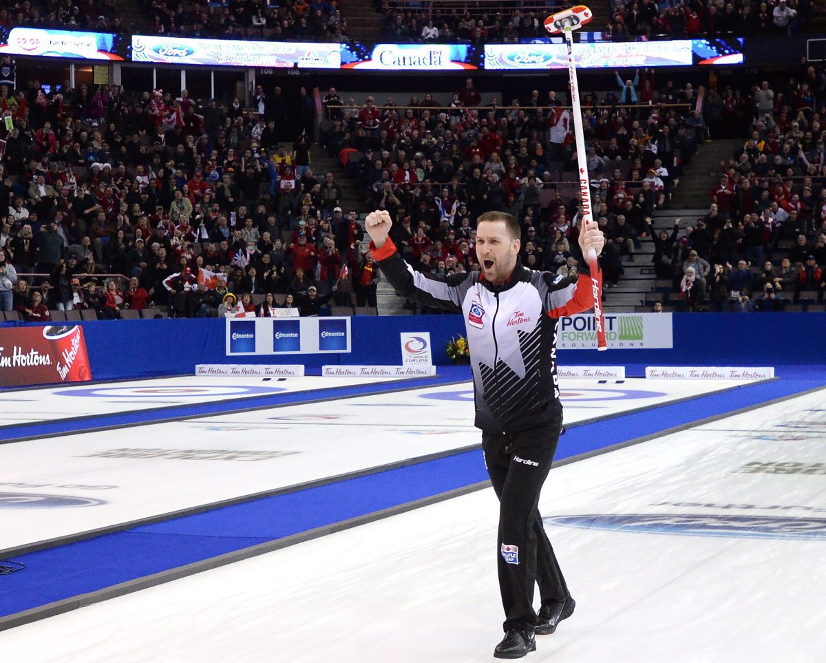 Canada skip Brad Gushue celebrates after defeating Sweden during the gold medal game at the Men's World Curling Championships in Edmonton, Sunday, April 9, 2017. THE CANADIAN PRESS/Jonathan Hayward.