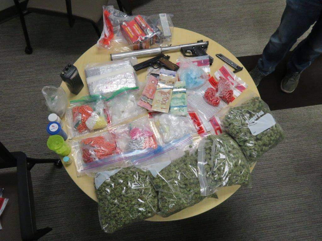 Saint John Police display the items they seized during their investigation.