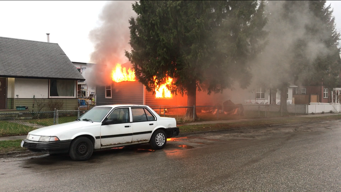 Flames consume Kelowna house following explosion. Body later discovered.