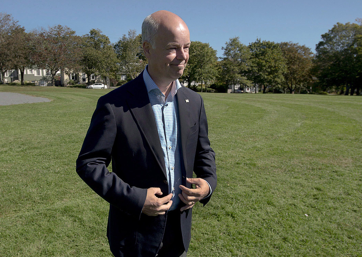 Progressive Conservative leader Jamie Baillie talks with reporters in Halifax on Wednesday, Oct. 9, 2013.