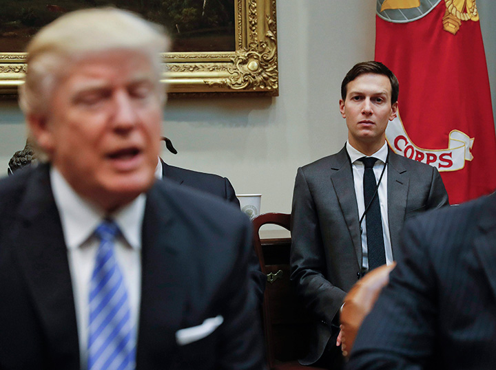 In this Monday, Jan. 23, 2017 file photo, White House Senior Adviser Jared Kushner, right, listens to President Donald Trump speak during a breakfast with business leaders in the Roosevelt Room of the White House in Washington. 