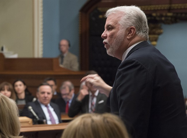 Premier Philippe Couillard says he won't make any decisions about changes to Quebec's flood policies until after Quebecers finish dealing with the fallout from the recent flood.