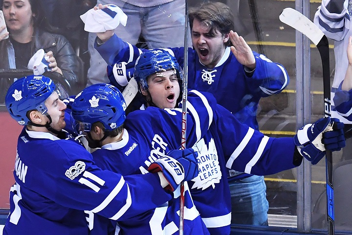 Toronto Maple Leafs centre Auston Matthews (34) celebrates his goal against the Washington Capitals with Maple Leafs centre Zach Hyman (11) and Maple Leafs right wing William Nylander (29) during first period NHL hockey round one playoff action in Toronto on Monday, April 17, 2017. 