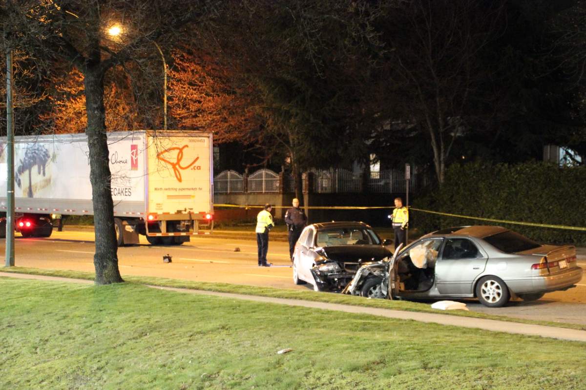 Police tape up after a fatal crash on Marine Drive in Vancouver Sunday night.