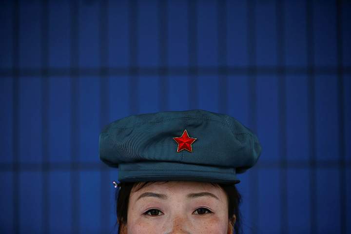 A guard secures gates of a catfish farm visited by a group of foreign reporters in Pyongyang, North Korea April 17, 2017.