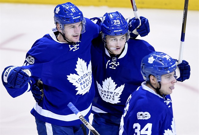 Toronto Maple Leafs centre Zach Hyman (11) celebrates his goal with teammates William Nylander (29) and Auston Matthews (34) during round one playoff action against the Washington Capitals in Toronto on April 19, 2017.
