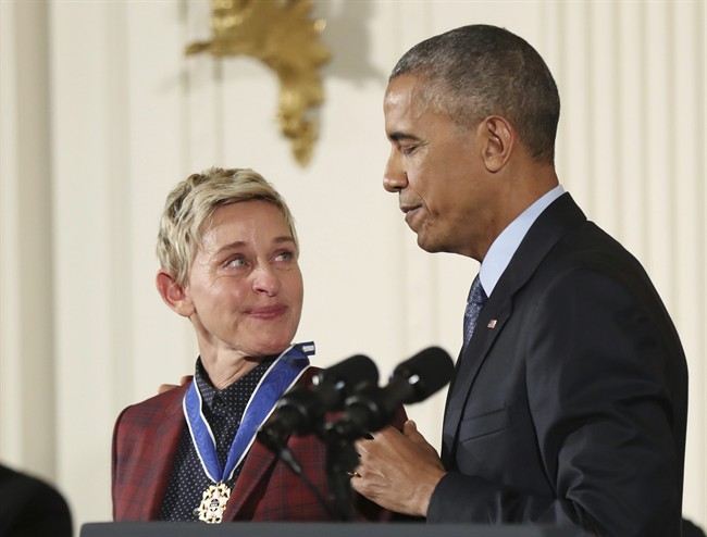 In this Nov. 22, 2016 file photo, actress, comedian, and talk show host Ellen DeGeneres, glances at President Barack Obama as she is presented the Presidential Medal of Freedom during a ceremony in the East Room of the White House in Washington. 